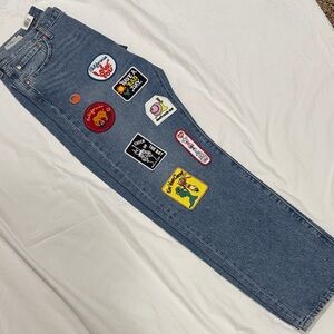 Stylish Blue Wide Leg Jeans with Fun Patches.Size 33x30